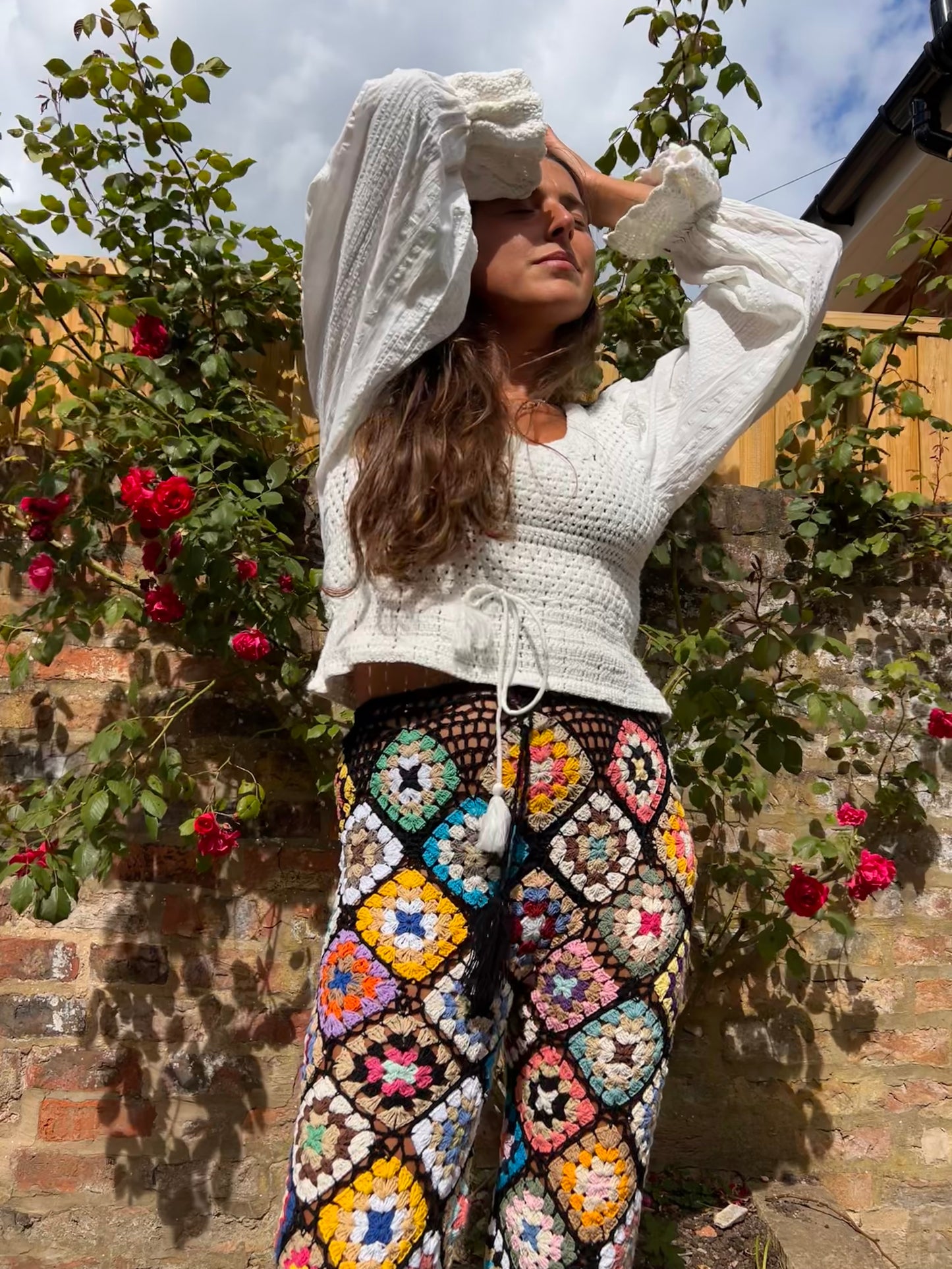 Black Granny square pom pom flare trousers with drawstring waist