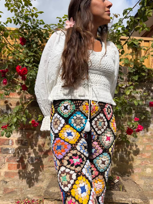 Black Granny square pom pom flare trousers with drawstring waist